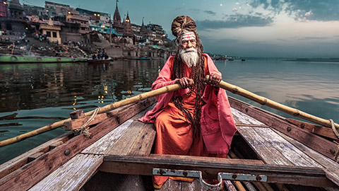 Varanassi boat man in a boat