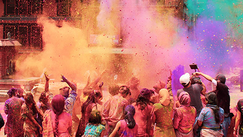 people participating in colourful holi celebrations