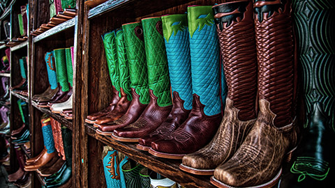 cowboy boots on a shelf