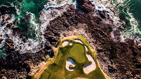golf course on the edge of the ocean