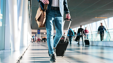 man walking through airport