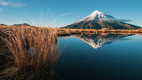 mt taranaki reflected in a lake