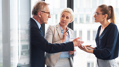 3 colleagues seriously discussing a project