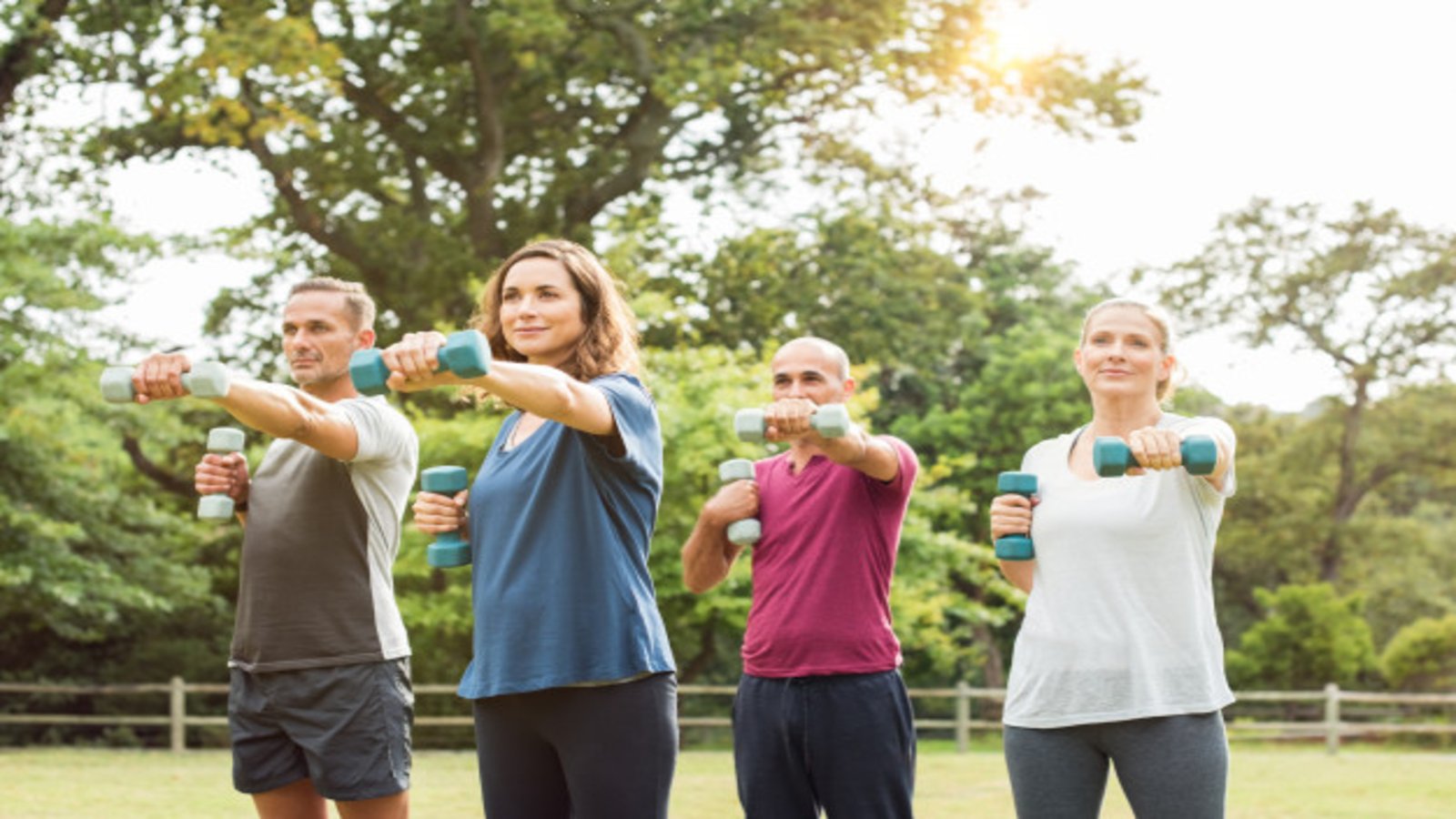 group participating in an outdoor strength fitness class