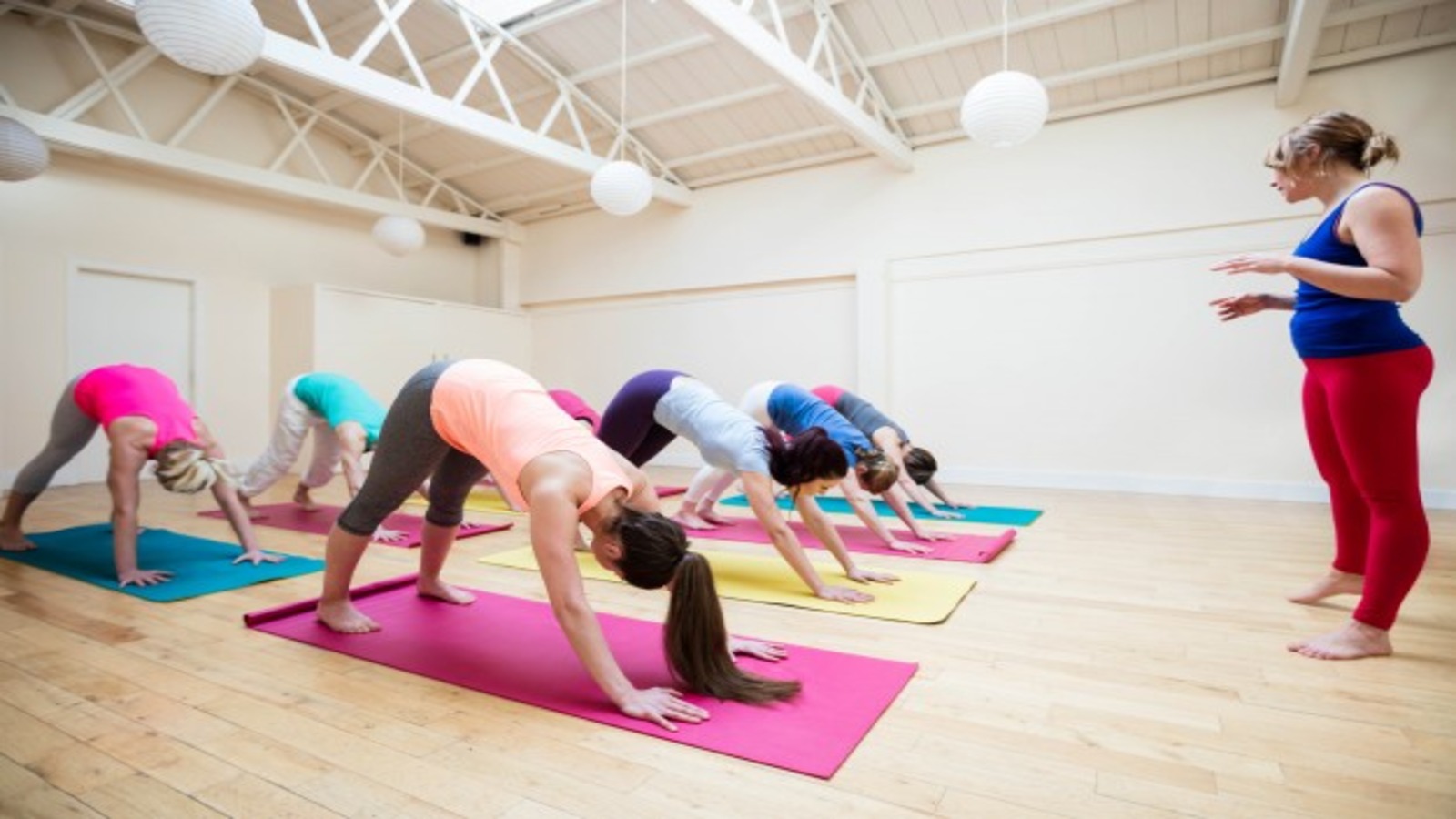 Instructor with participants of a yoga class