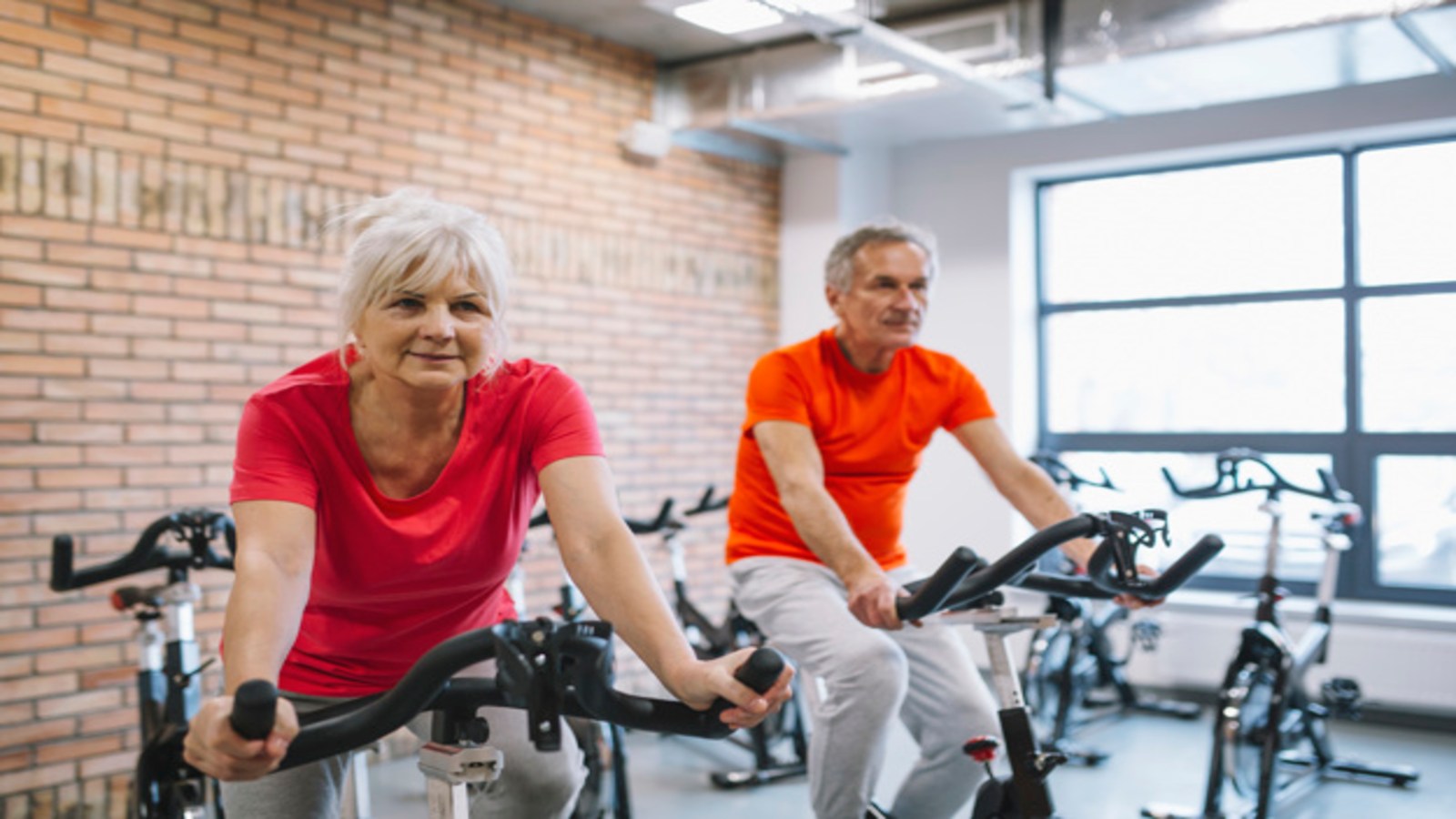 elderly clients on stationery bikes