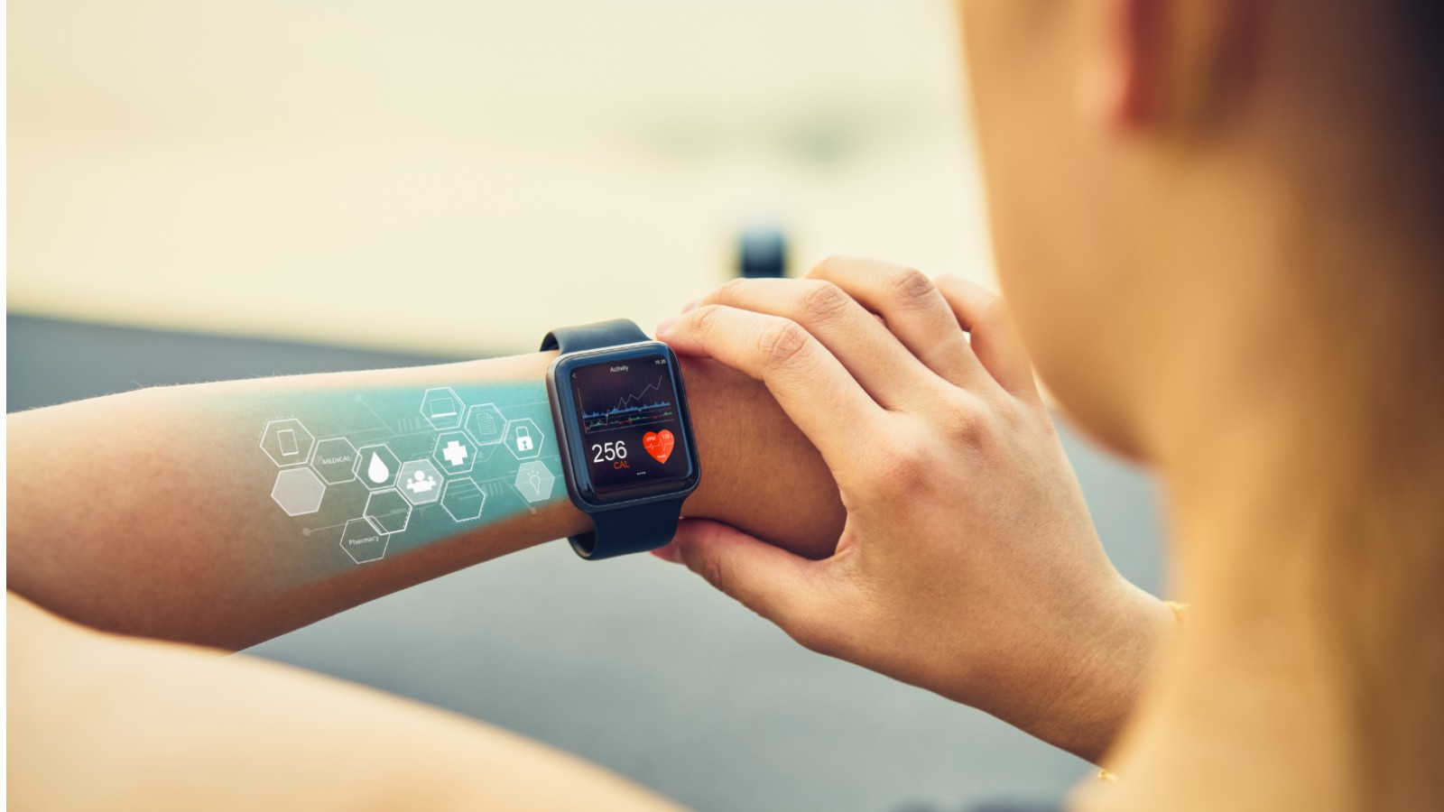 Woman in fitness attire checking her exercise progress on a smart watch