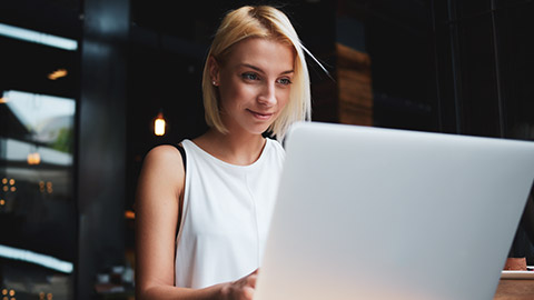 Woman using laptop computer for online shopping