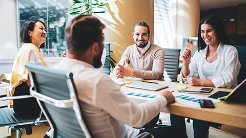 Grouup of business colleagues in relaxed mood discussing business