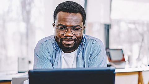 Man checking his recent transaction on his computer