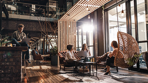 Wide shot of a group working in a modern office